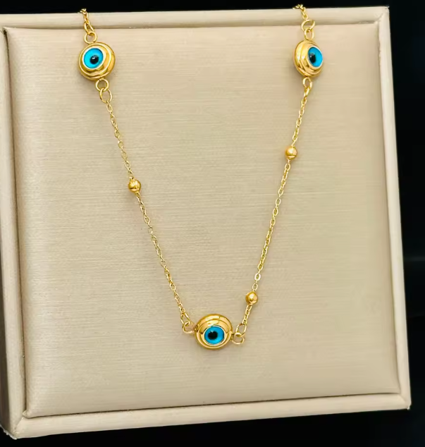 مجموعة مجوهرات نسائية من الفولاذ المقاوم للصدأ بلون الذهب – قلادة، أقراط وسوار بتصميم عين الشر